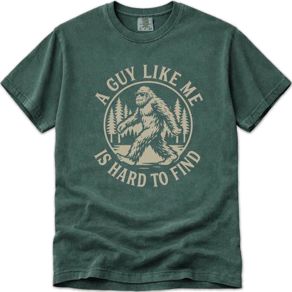 A Guy Like Me Is Hard To Find Funny Bigfoot T-Shirt - Blue Spruce